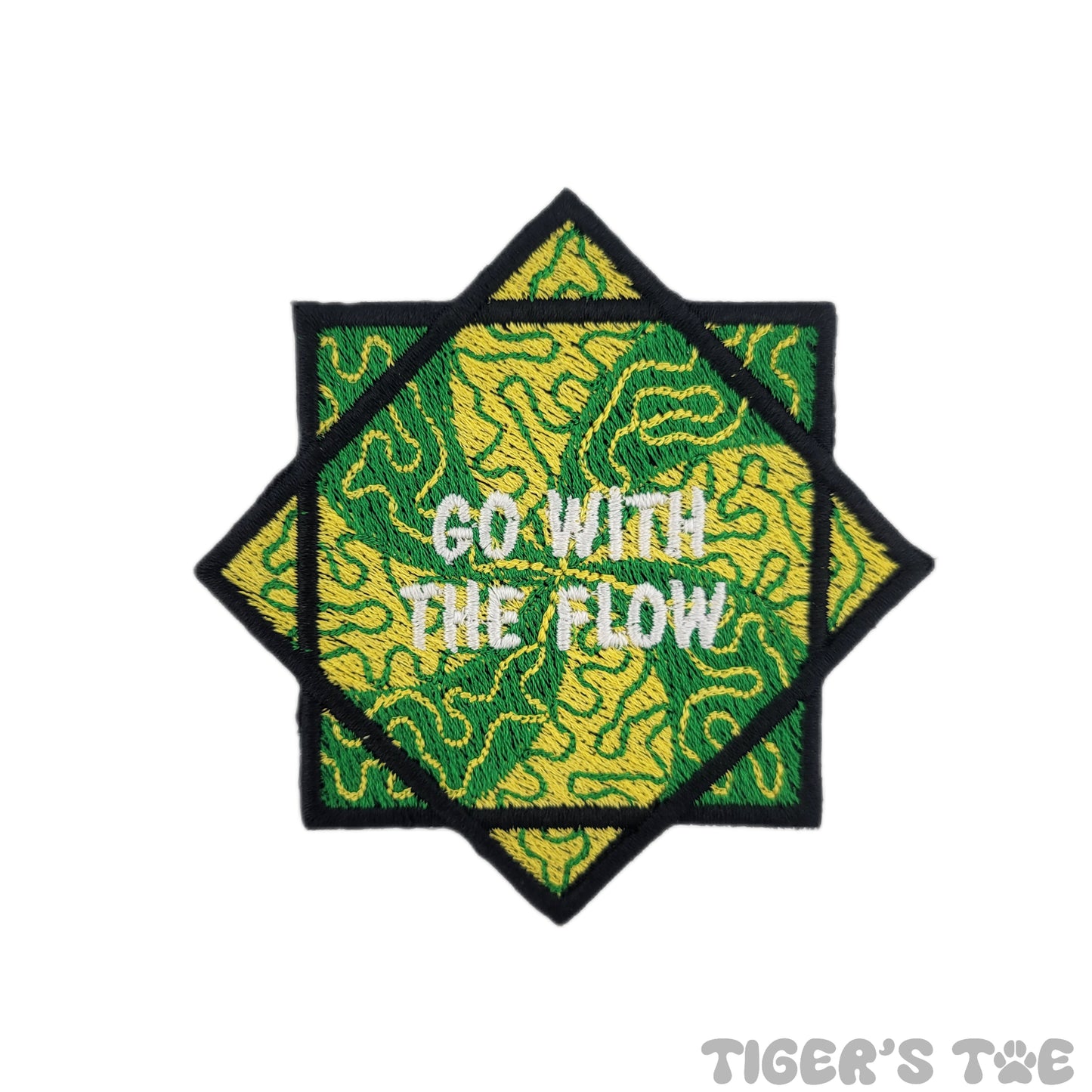 Embroidered patch of a green and yellow flow star with decorative swirls. The center of the flow star reads "GO WITH THE FLOW" in white text.