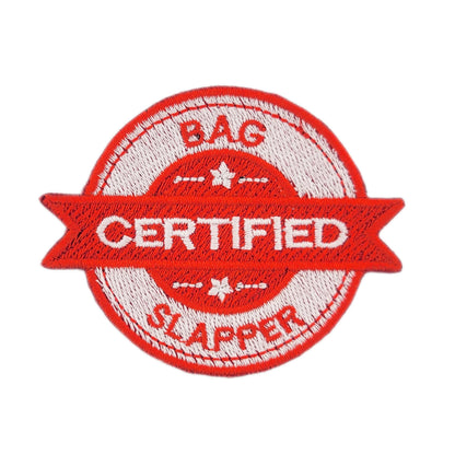 Red and white patch with 'CERTIFIED BAG SLAPPER' text on a white background