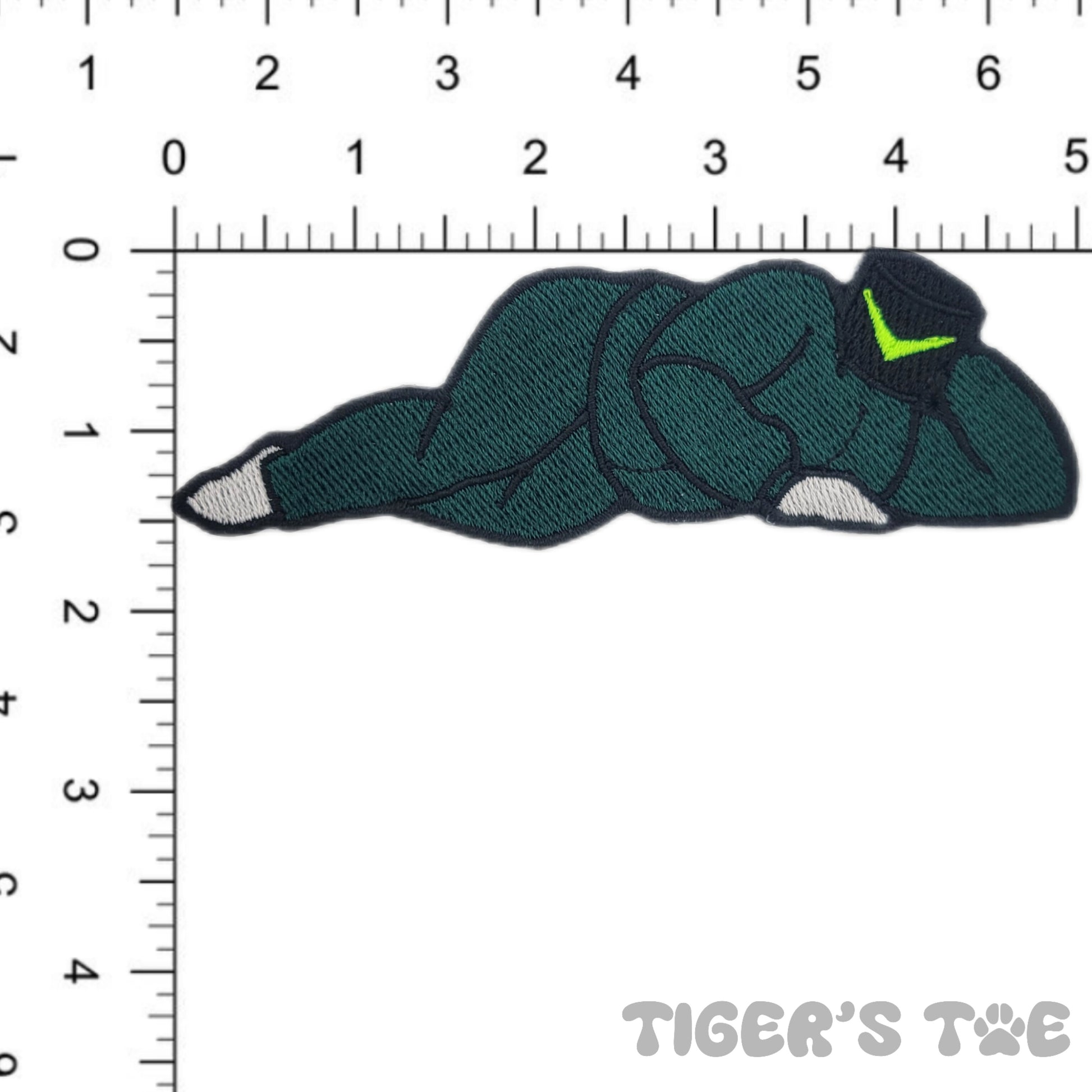 A patch depicting a stylized, embroidered Dark Wobble in a seductive pose, designed to be applied as an applique or patch.
