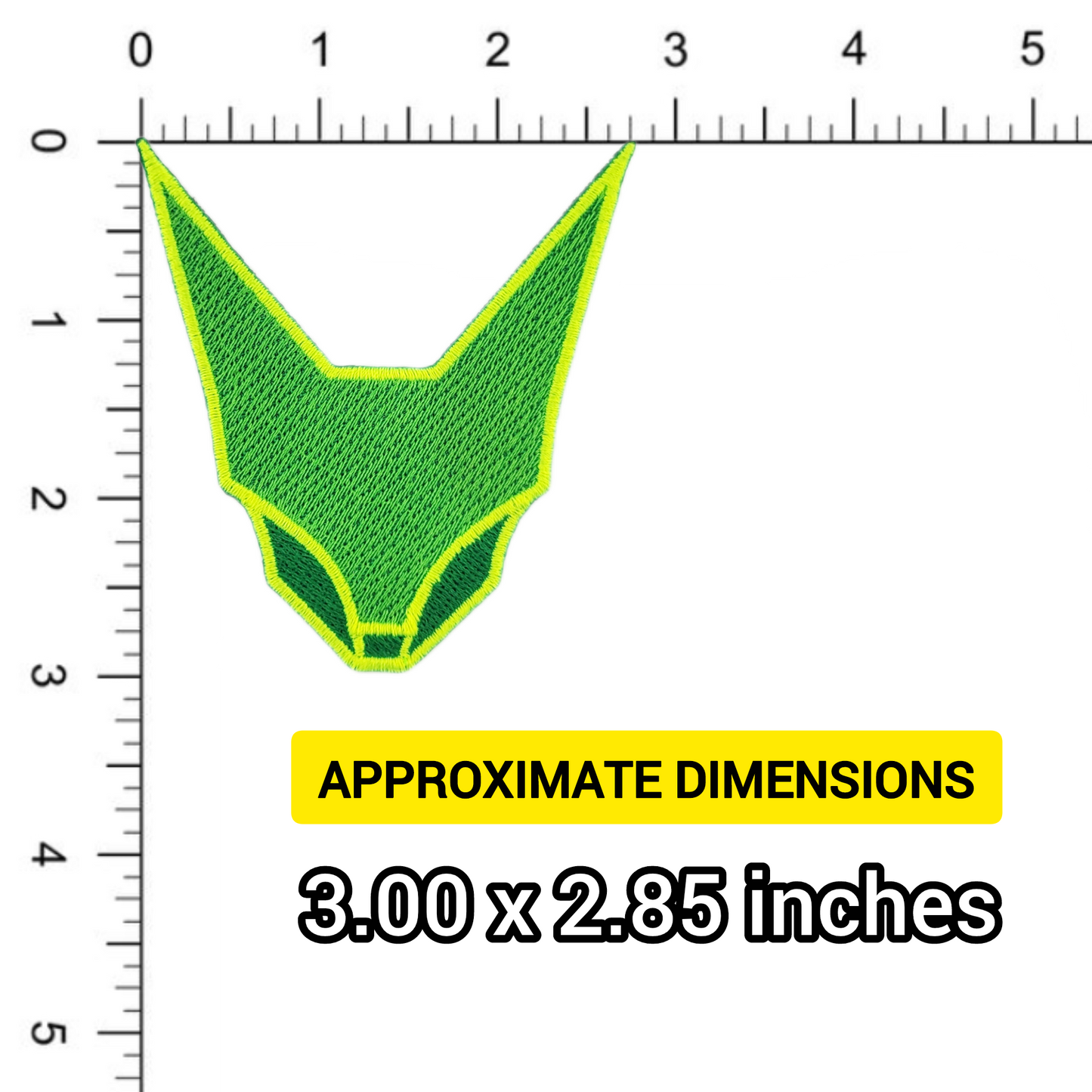 Green geometric abstraction feline face patch, shown against a ruler for scale.