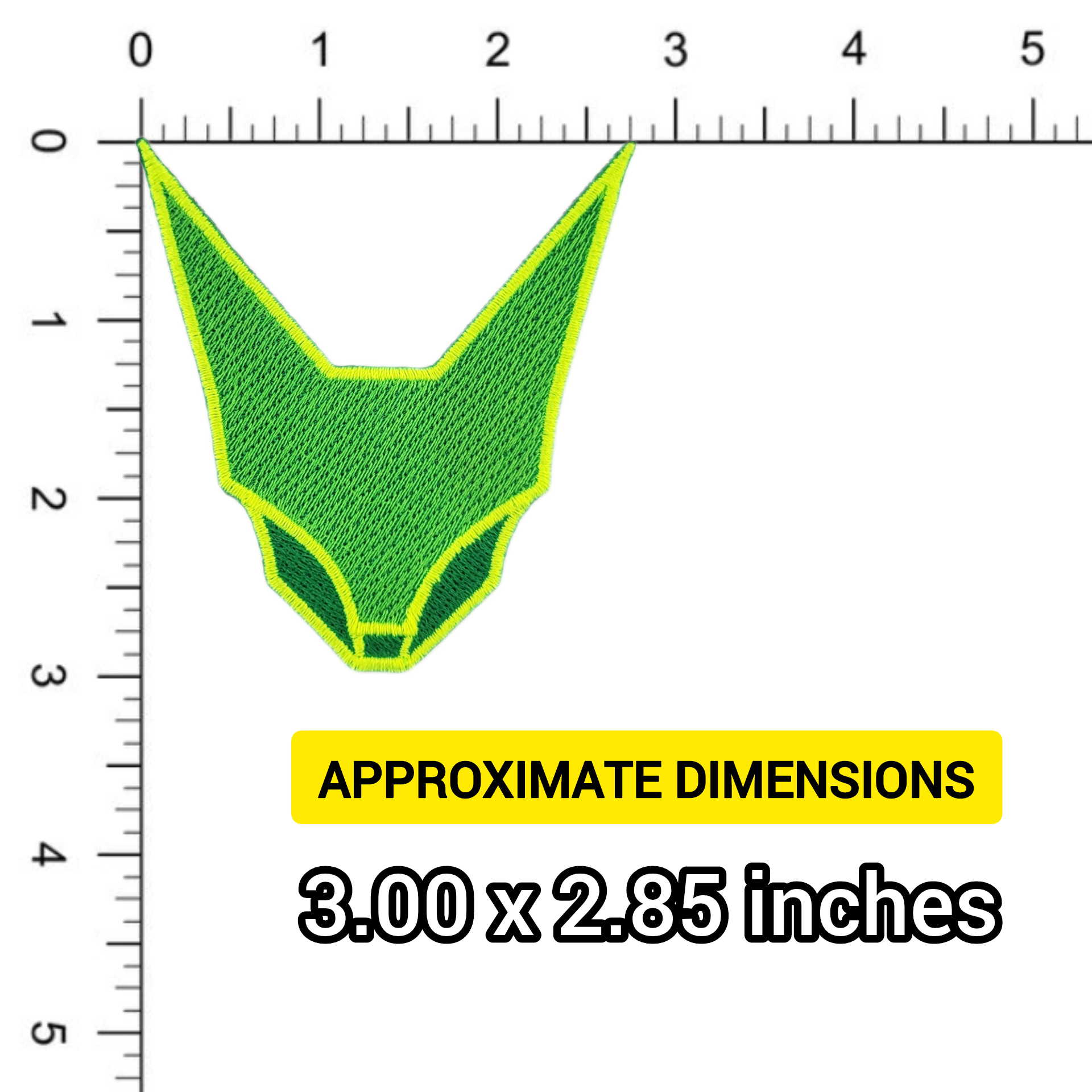 Green geometric abstraction feline face patch, shown against a ruler for scale.