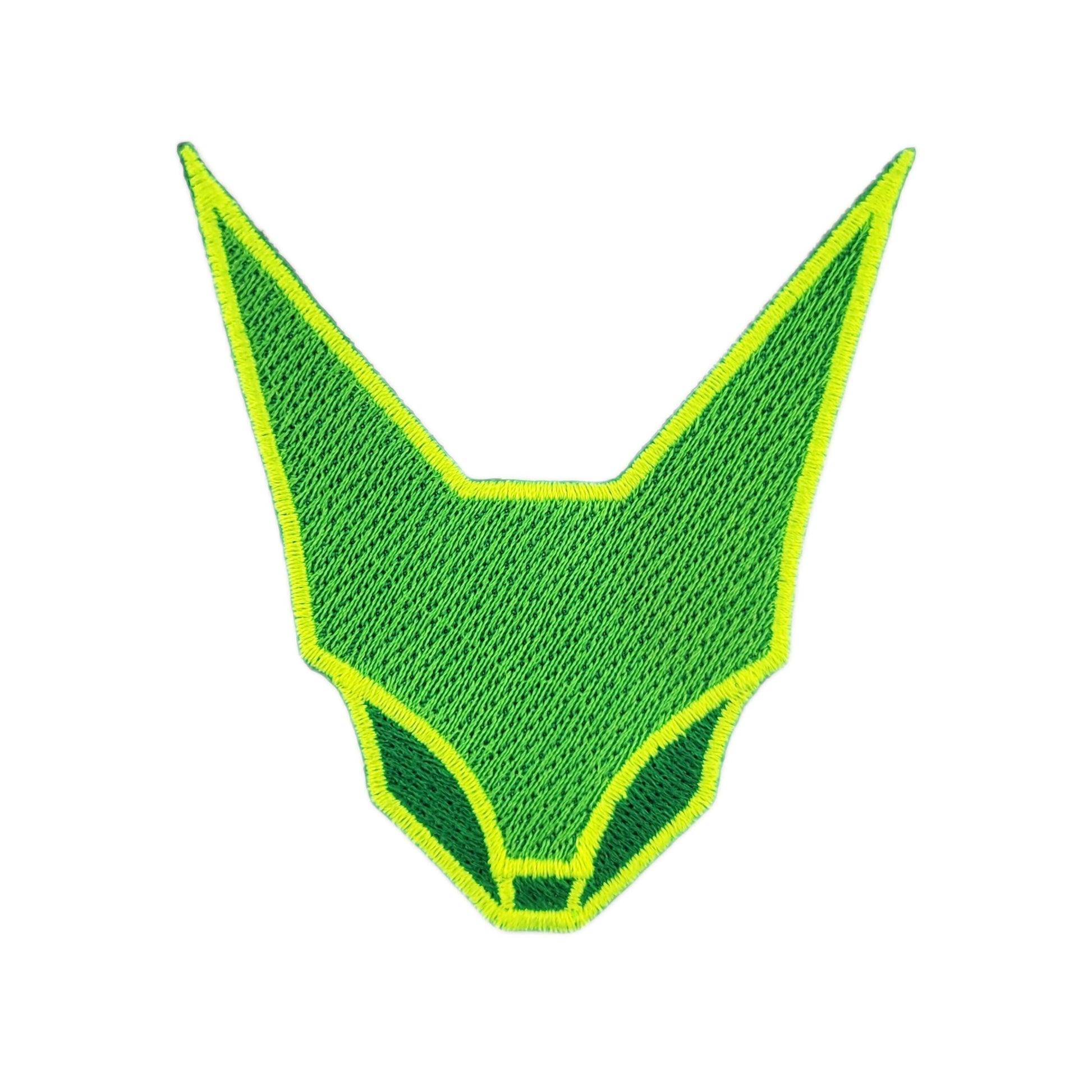 Green geometric abstraction feline face patch, embroidered with blacklight-reactive embroidery thread.