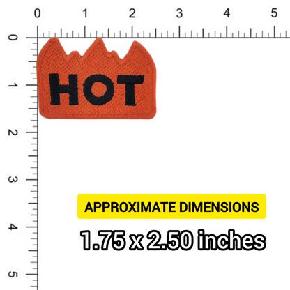 Orange flame-shaped patch with 'HOT' text on a ruler for size reference