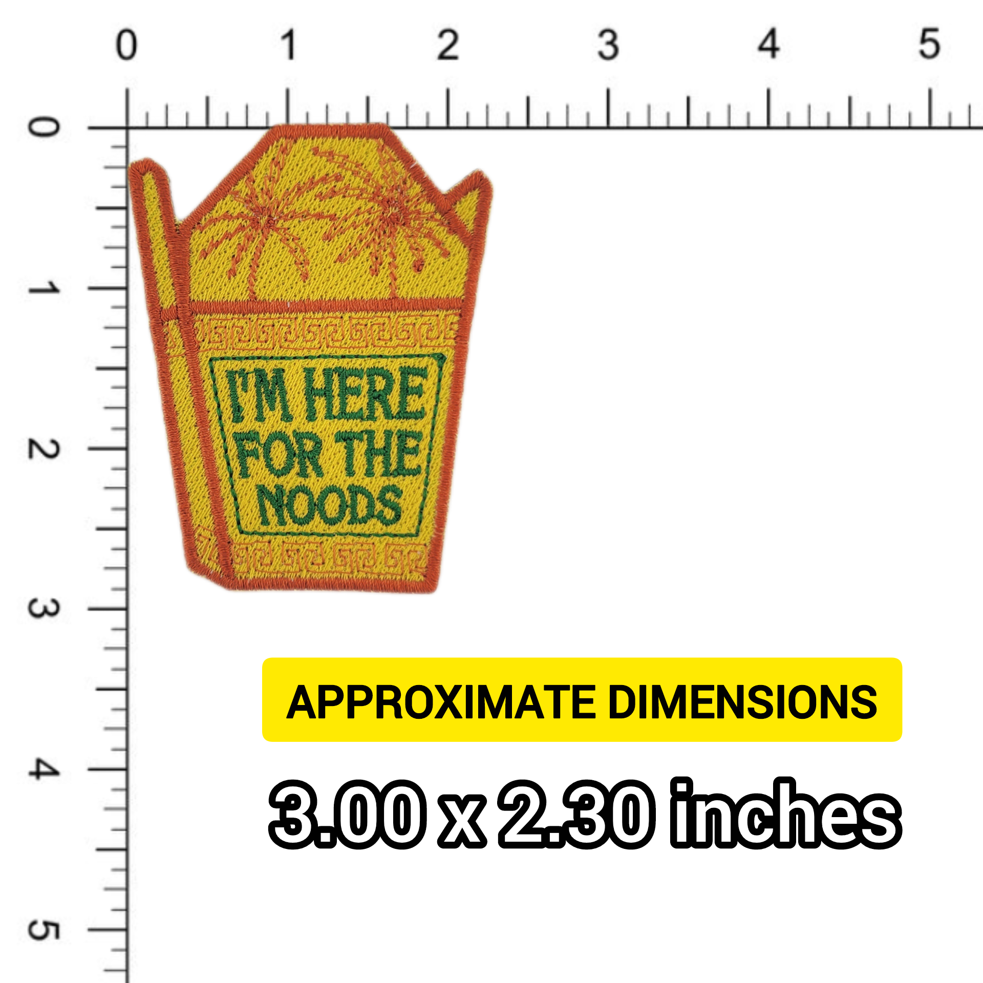 Patch of a yellow noodle takeout container with text 'I'm here for the noods' written in green shown on a ruler for scale
