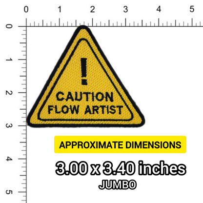 Yellow triangle warning sign with 'Caution Flow Artist' text and measurement scale on a white background