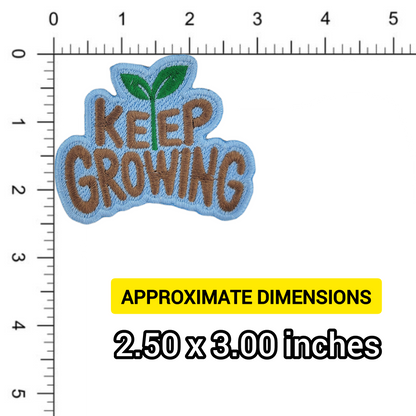 Embroidered patch with 'Keep Growing' text and a leaf symbol, measured against a ruler.