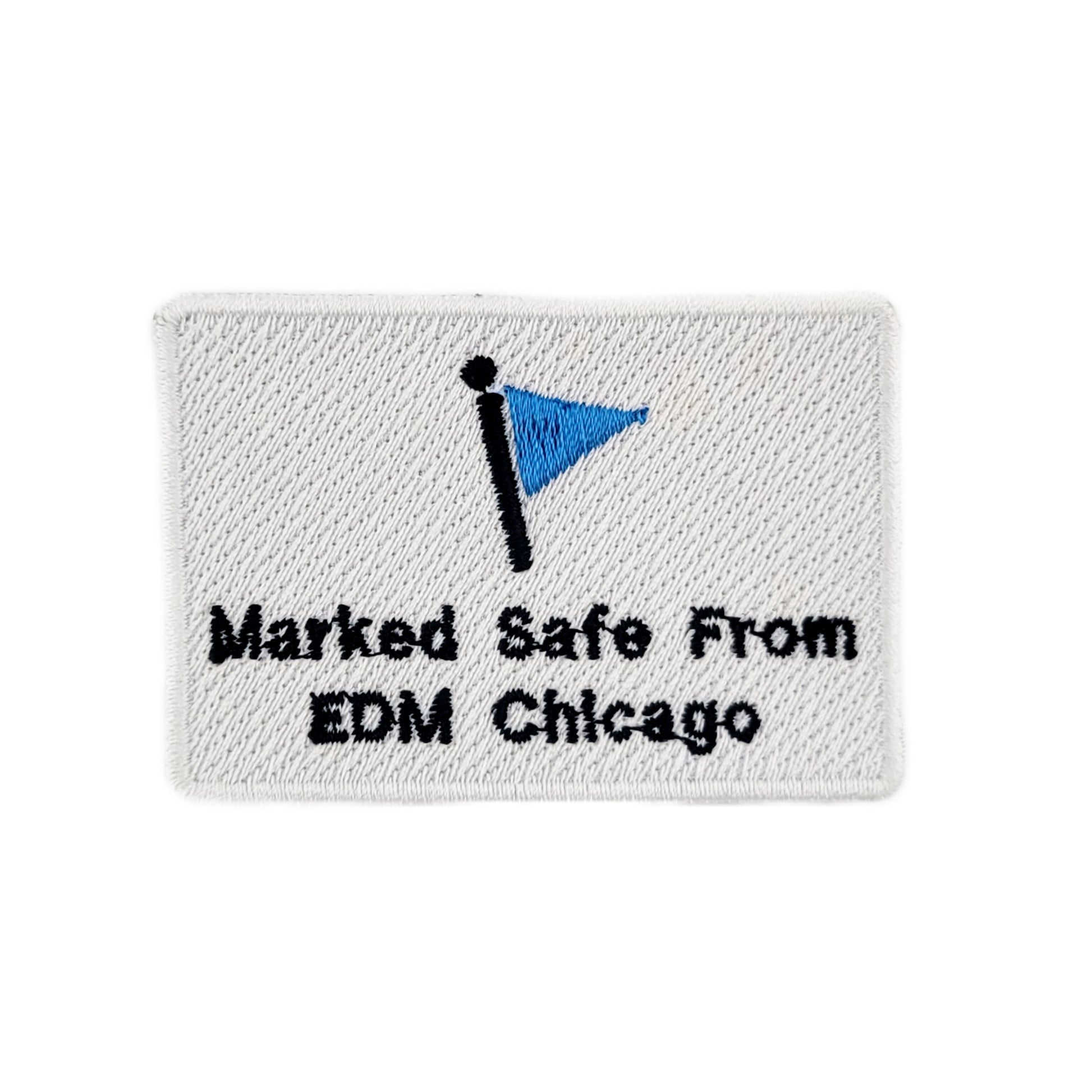 Embroidered patch with blue flag and text 'Marked Safe From EDM Chicago' on a white background