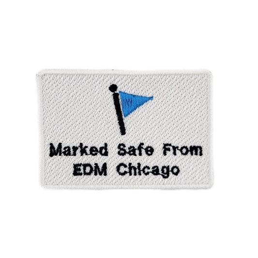 Embroidered patch with blue flag and text 'Marked Safe From EDM Chicago' on a white background