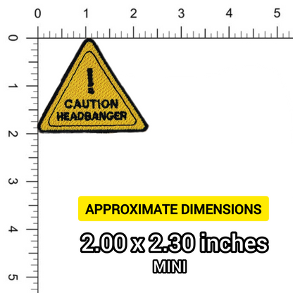 Yellow and black warning triangle patch with 'Caution Headbanger' text on a ruler for scale.