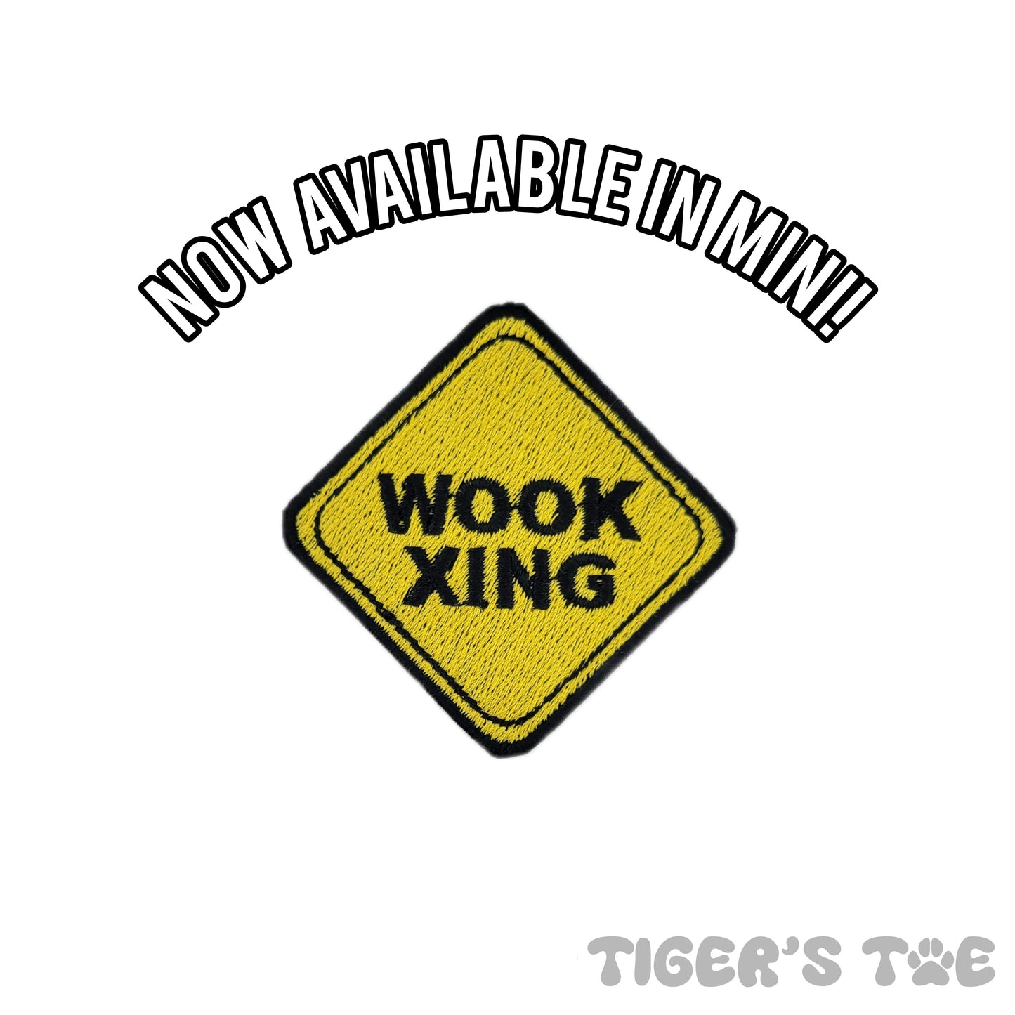 yellow embroidered patch in the shape of a crossing sign that reads 'wook xing'