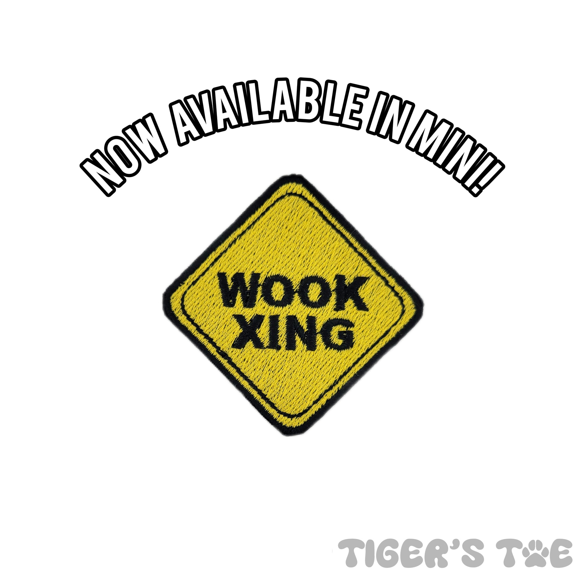 yellow embroidered patch in the shape of a crossing sign that reads 'wook xing'