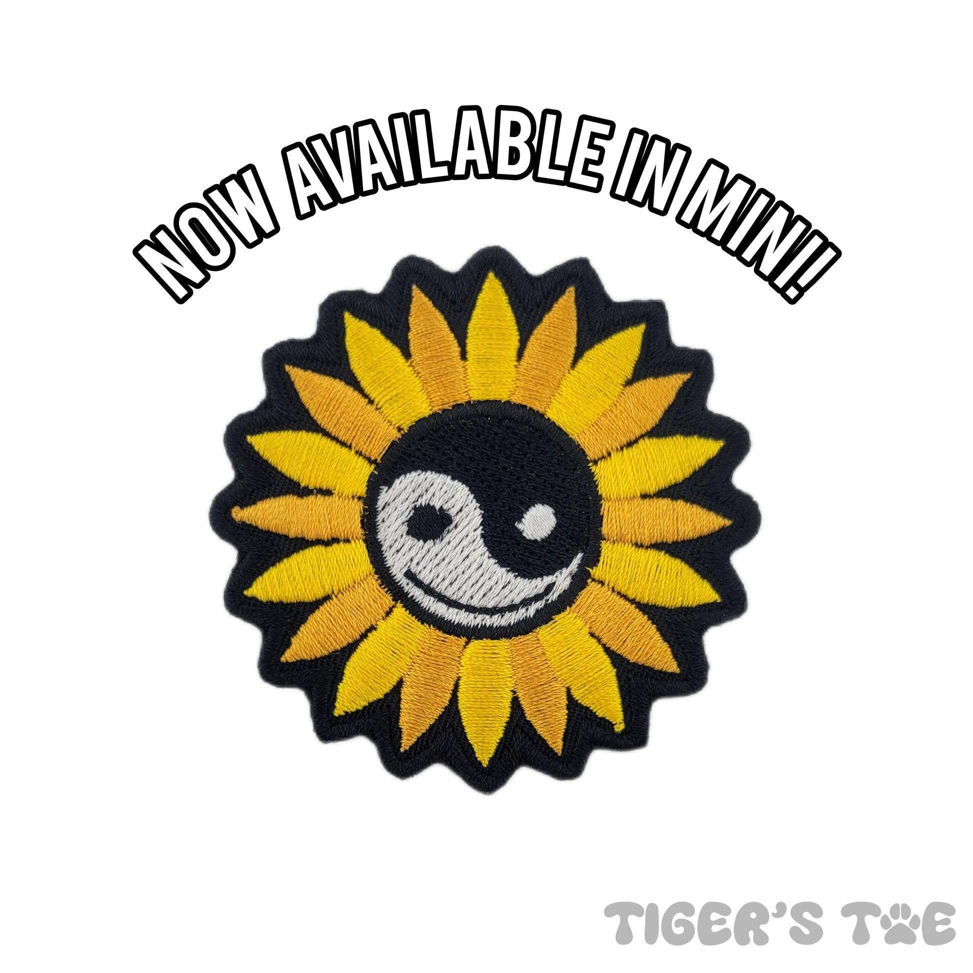 embroidered patch of a sunflower with a yin-yang symbol in the center