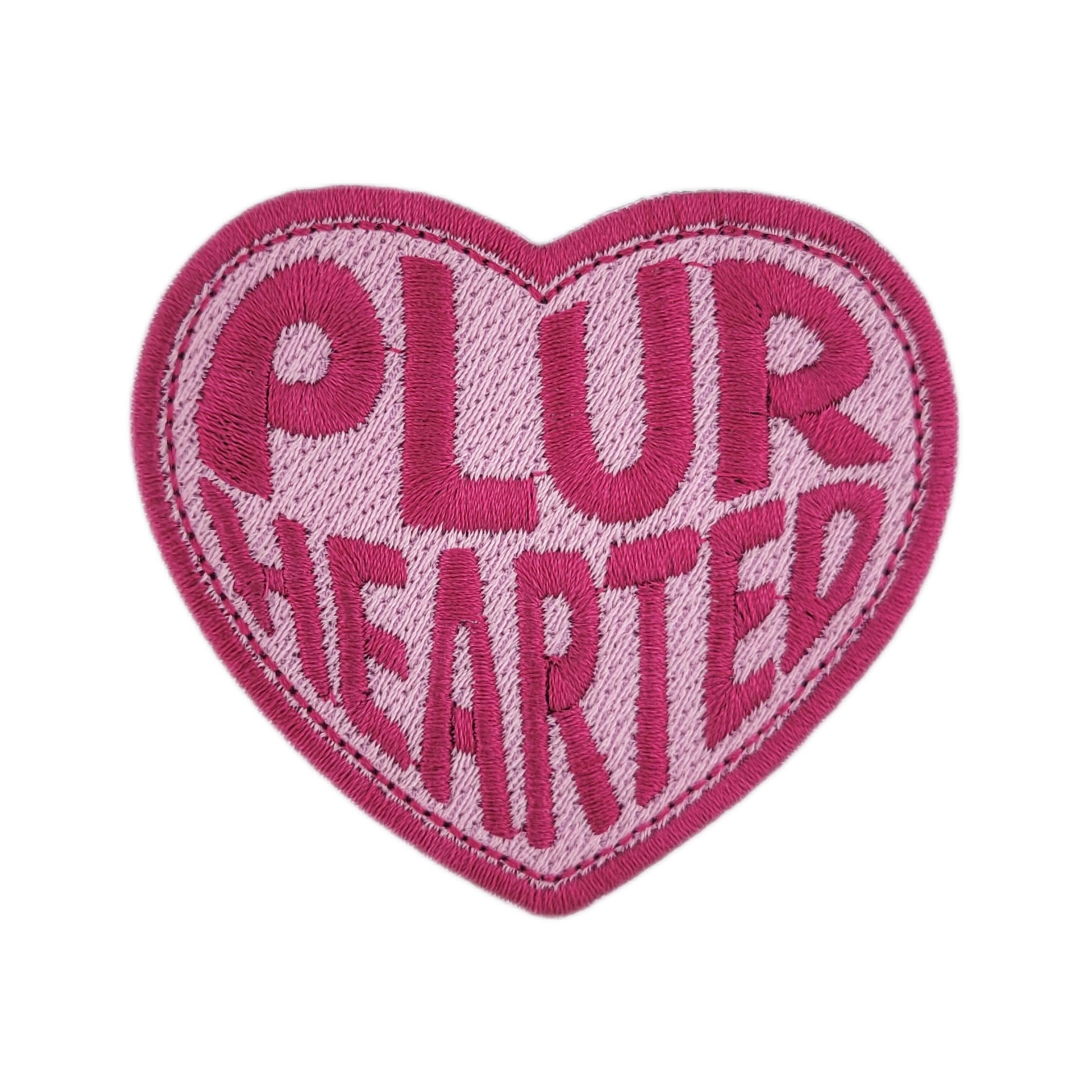 Heart-shaped patch with 'PLUR HEARTED' text on a white background