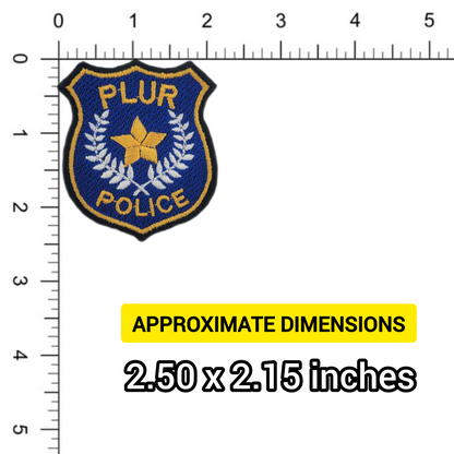 Police badge patch with star design and 'PLUR Police' text, measured against a ruler.