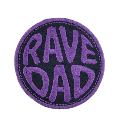 Circular patch with 'RAVE DAD' text in purple on a black background