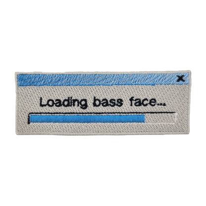 Embroidered patch with text 'Loading bass face...' on a grey background. Made to resemble a retro loading bar window.