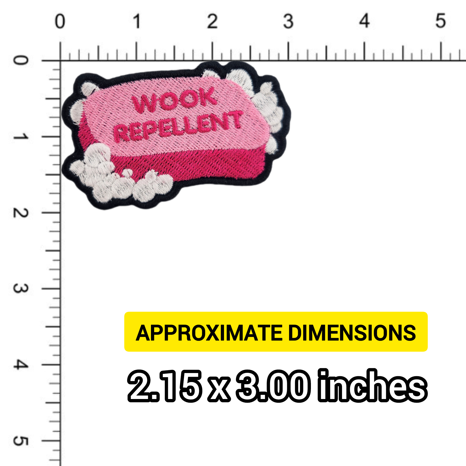 Pink soap patch with 'WOOK REPELLENT' text on a ruler for size reference