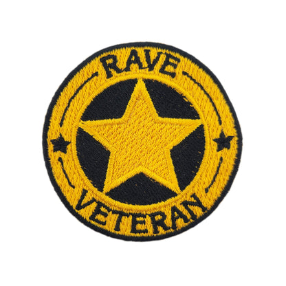Patch with yellow star and text 'RAVE VETERAN' on a white background