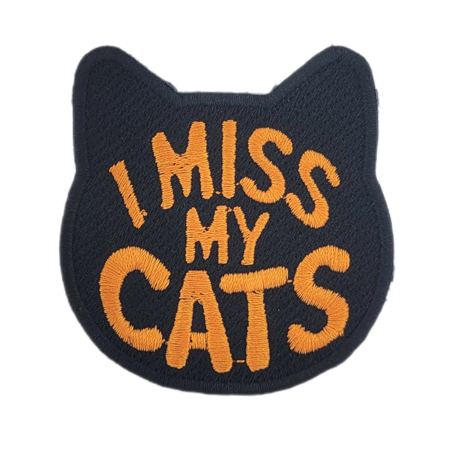 Embroidered patch with 'I MISS MY CATS' in orange text on a black background