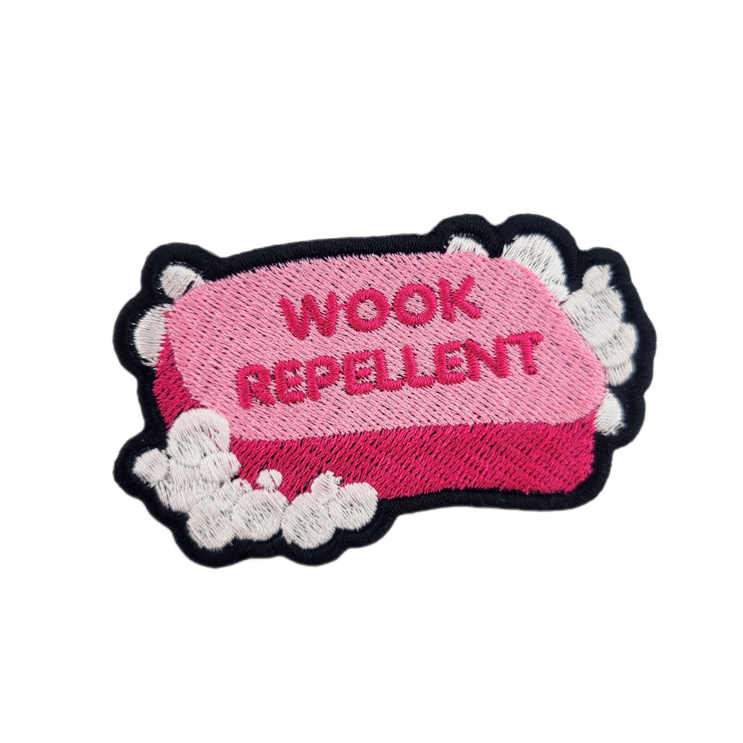 Patch with 'WOOK REPELLENT' text on a pink bar of soap, surrounded by white suds/bubbles.
