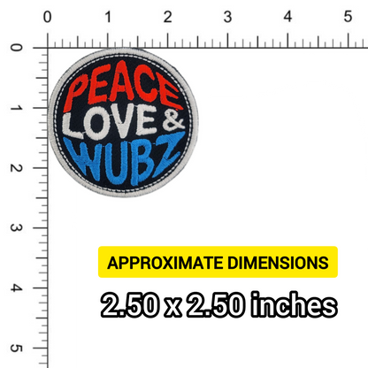 Patch with 'Peace Love & Wubz' text on a ruler for size reference