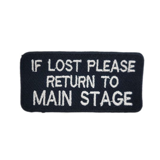 Black patch with white text 'IF LOST PLEASE RETURN TO MAIN STAGE' on a white background