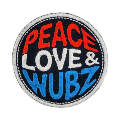 Round patch with 'Peace Love & Wubz' text on a black background