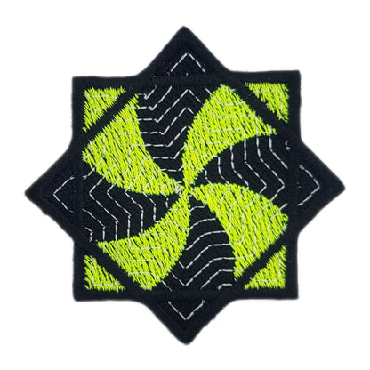 Embroidered patch of a yellow and black flow star on a white background