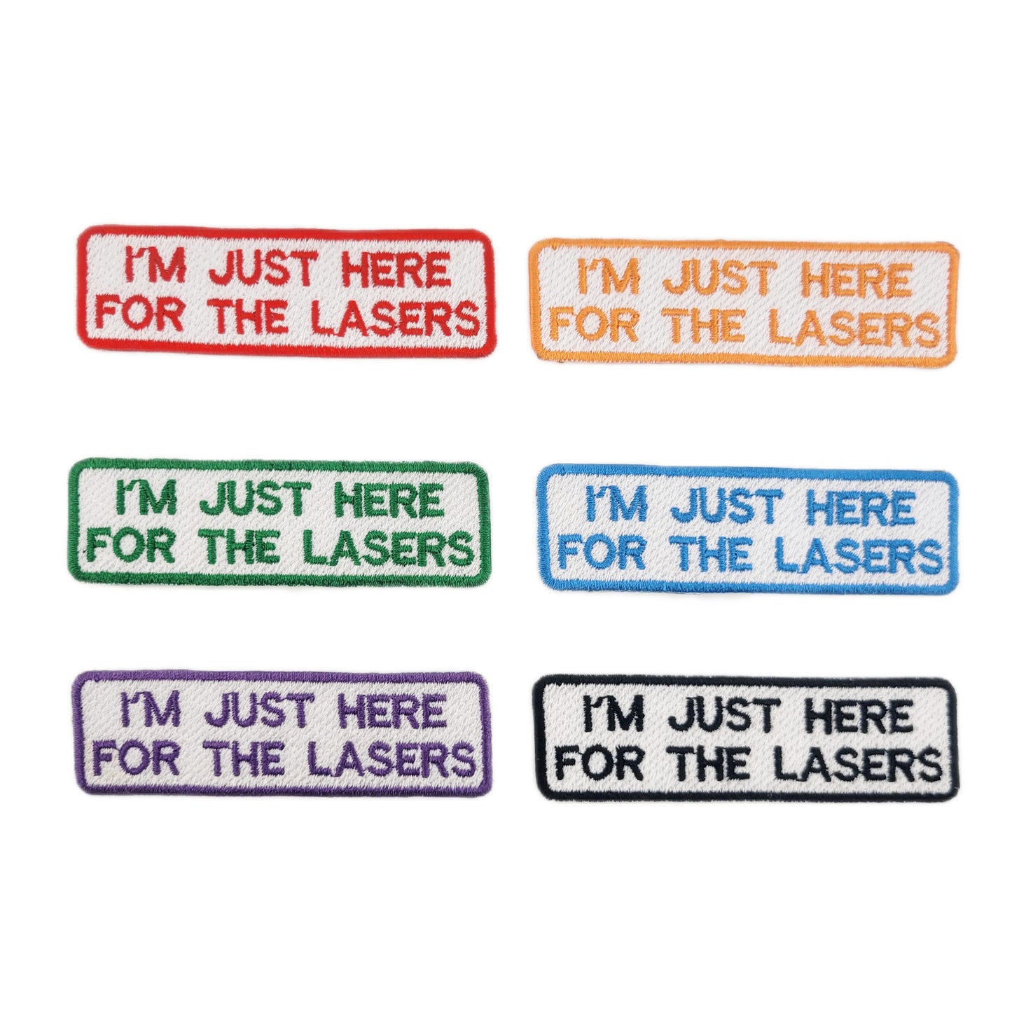 Set of embroidered patches with 'I'm just here for the lasers' text in various colors on a white background.