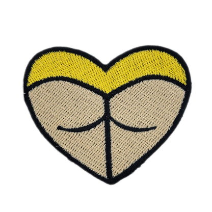 Heart-shaped rave booty embroidered patch, with yellow bottoms and a light skin tone.