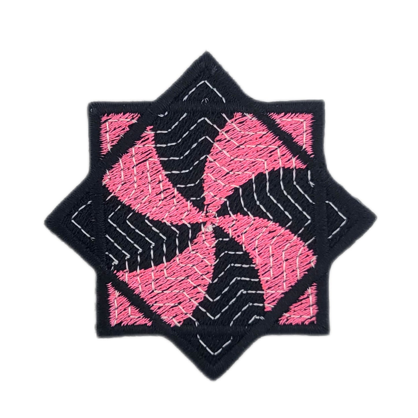 Embroidered patch of a pink and black flow star on a white background
