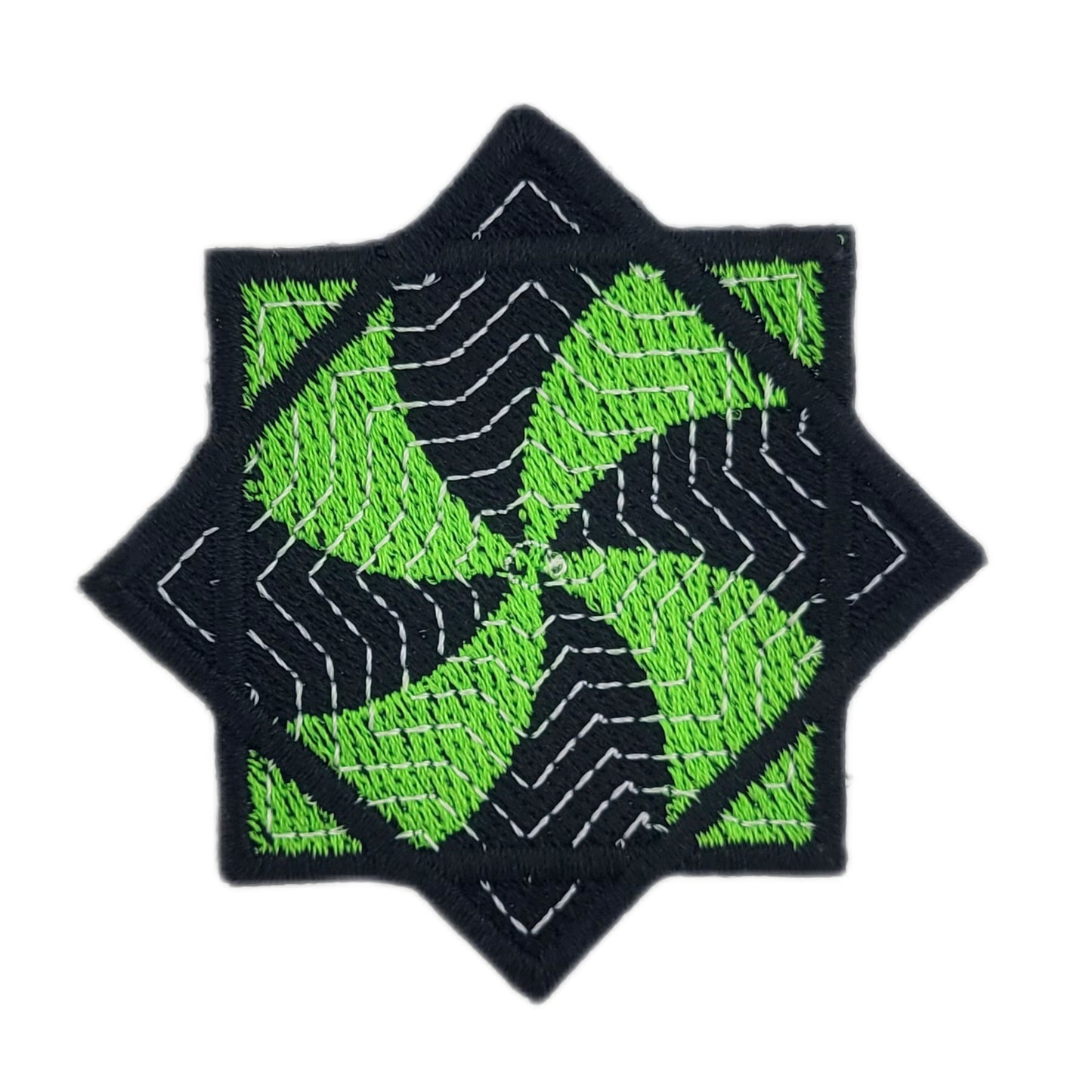 Embroidered patch of a green and black flow star on a white background
