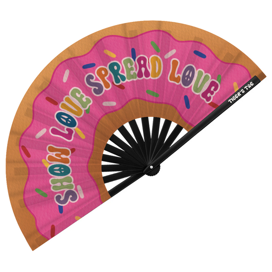 Handheld fan with pink donut design and 'Show Love Spread Love' text on a white background