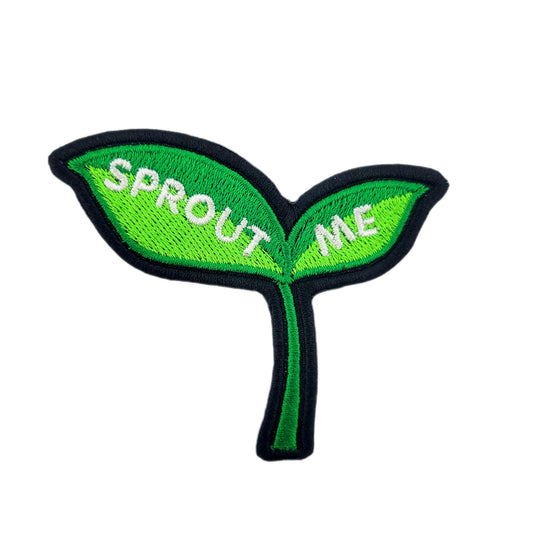 Embroidered patch shaped like a green leaf with 'SPROUT ME' text on a white background
