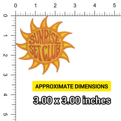 Sun-shaped patch with 'Sunrise Set Club' text on a white background against a ruler for scale
