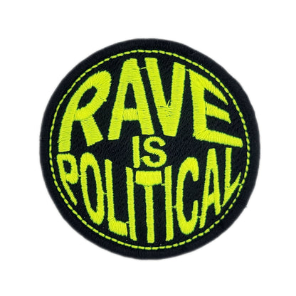 Round patch with 'RAVE IS POLITICAL' text in yellow on a black background